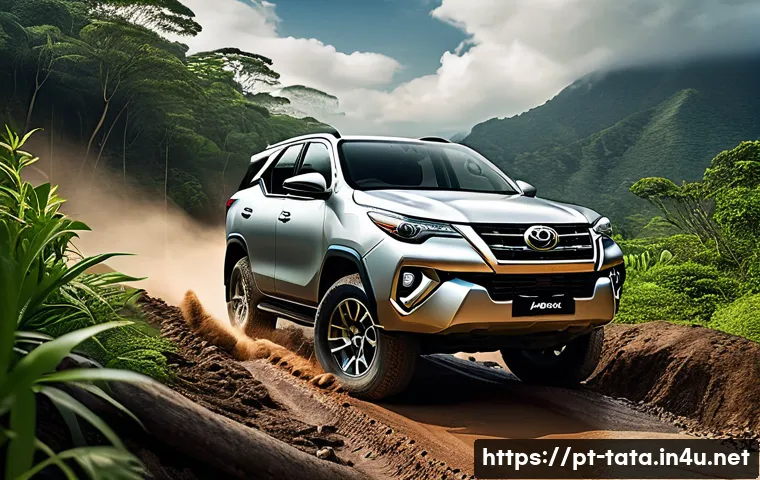 타타 사파리와 도요타 포춘 비교 - A rugged Toyota Fortuner SUV driving confidently on a challenging off-road trail with muddy terrain,...